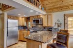 Large granite counter tops and top of the line appliances 